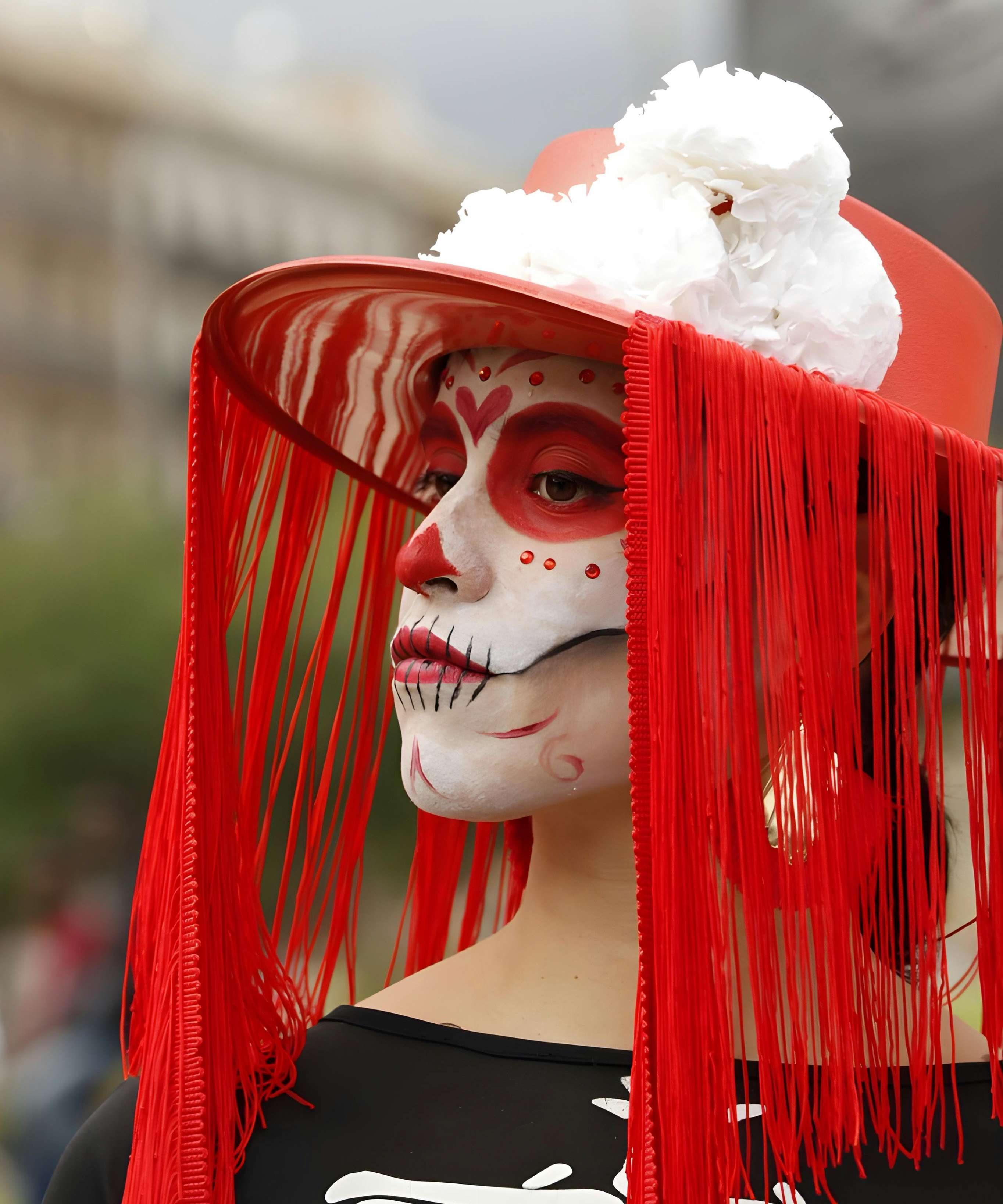 Close-up of a woman in Dia de los Muertos makeup, Barcelona.